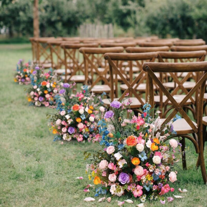 Wildflower Meadow Aisle Arrangements | Colorful Pink, Purple & Orange Wedding Ground Florals